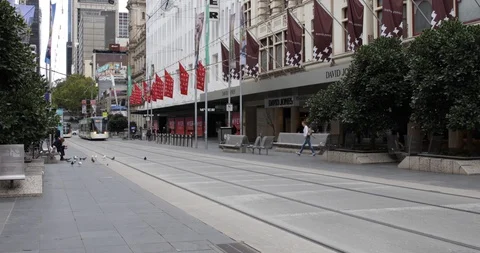 Melbourne Tram Moves Through Deserted Shopping Mall COVID 19 Coronavirus Stock Footage 128940039