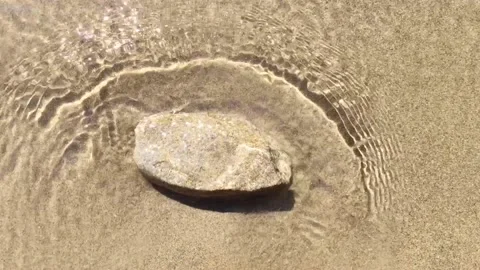 Mellow River Shore Waves Breaking on a Little Rock Video stock 95172512