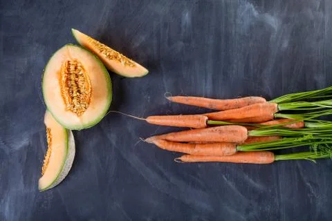 Melon and carrots Stock Photos