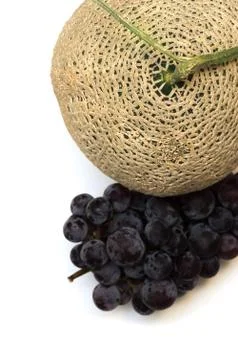 Melon and grape on white background Stock Photos