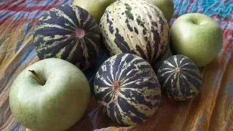 Melon and Green Apple Standing On The Table 3 Stock Footage 142515478