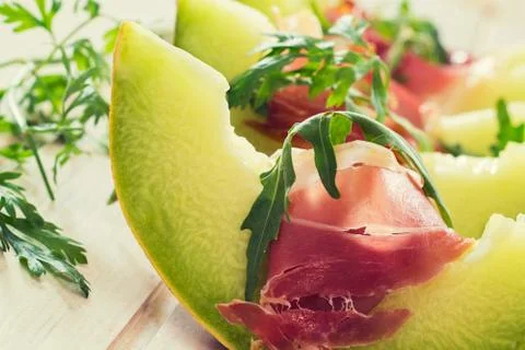 Melon and prosciutto Stock Photos