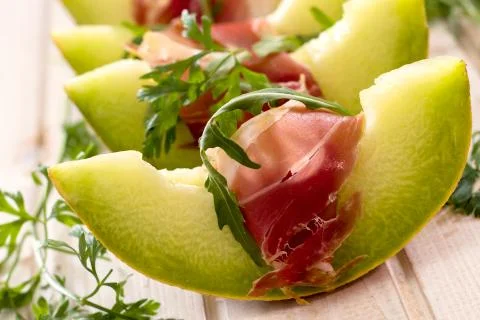 Melon and prosciutto Stock Photos