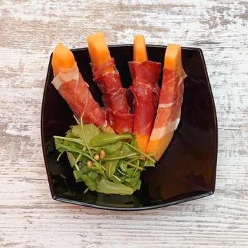 Melon and Prosciutto Stock Photos