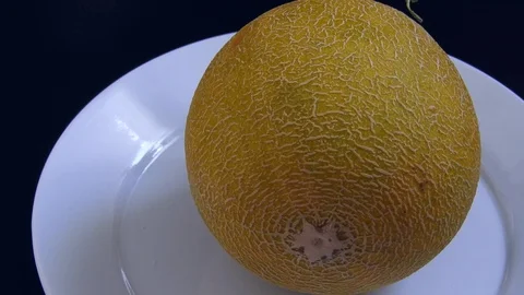 Melon, beautifully flavored melon on the rotating stand, 動画素材 129856769