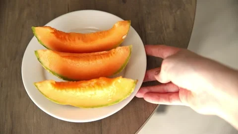Melon Charente slice ripe sweet fruit tasty snack fresh delicious gourmet food Stock Footage 317101489
