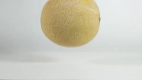 Melon exploding on white table Stock Footage 145792961