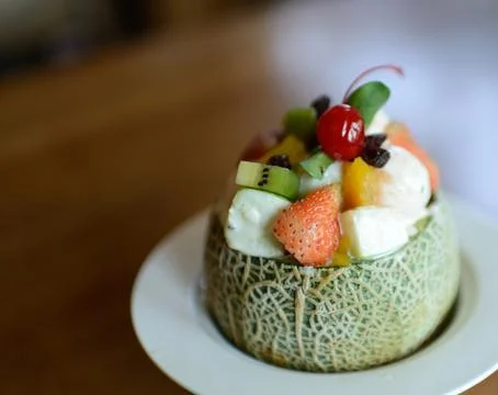 Melon with fruit salad Stock Photos