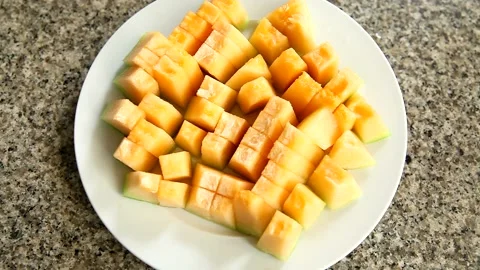 Melon fruit on white plate, Backgrounds Stock Footage 140076438