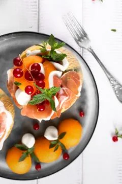 Melon ham mozzarella cheese Stock Photos