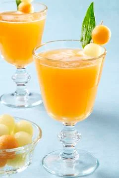 Melon juice with melon balls Foto stock