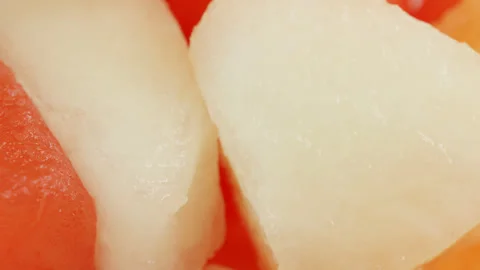 Melon mix cubes macro close up presentation slowly rotating stock footage Stock Footage 344695432