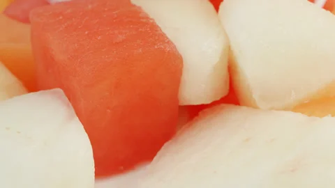 Melon mix cubes macro close up presentation slowly rotating stock footage Stock Footage 344695657