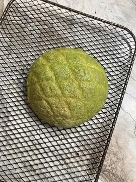 Melon Ppang, a fluffy Korean bread shaped like a melon with a crisp, sugary.. Stock Photos