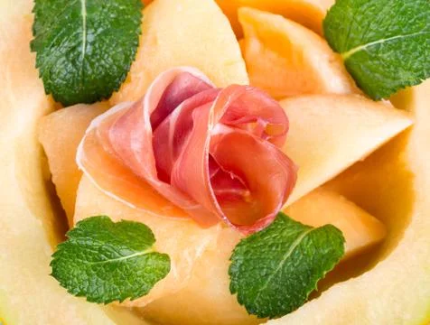 Melon with prosciutto Stock Photos