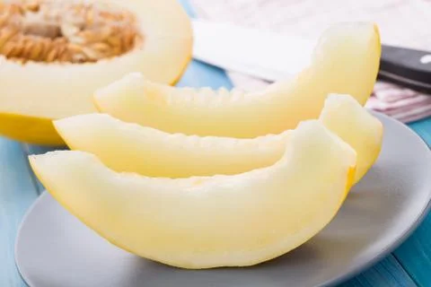 Melon slices on a plate Stock Photos