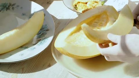 Melon slicing. The chef cuts half of the melon into wedges. Stock Footage 157204659