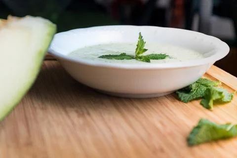 Melon soup with cucumber and mint. Stock Photos