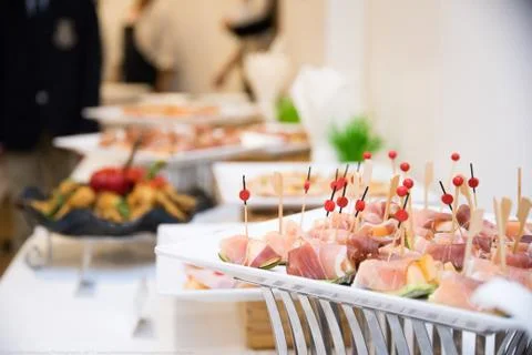Melon wrapped in parma ham on a stick Stock Photos