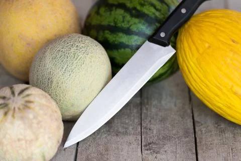 Melons with knife 写真素材