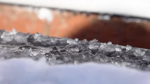 Melt water dripping from a rooftop Stock Footage 147231970