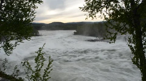 Melt water flooded violent river waterfall in summer Stock Footage 47350682