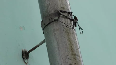 Melt water flows down from the roof pipe. Stock Footage 113182553