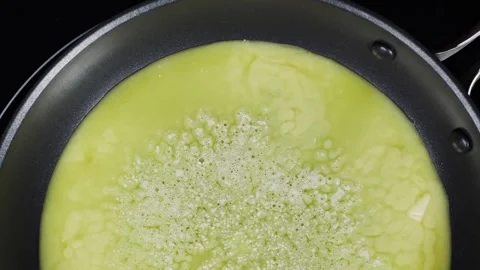Melted butter being boiled. Close up. Boiling pot, boiling oil fried food Stock Footage 148516462