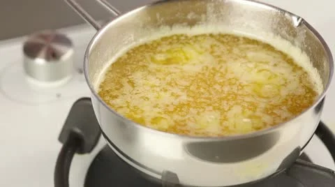 Melted butter being boiled Stock Footage 24671459