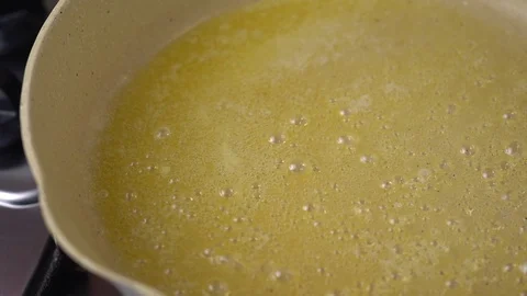 Melted butter frying  Stock Footage 128637840