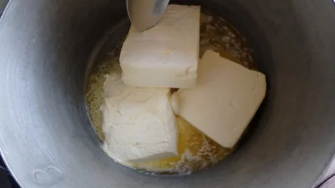 Melted butter with sugar on steam bath for sweet dessert Stock Footage 88528552