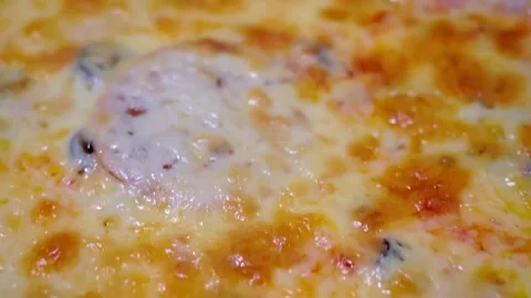 Melted cheese bubbling on pizza in kitchen Video stock 328538122