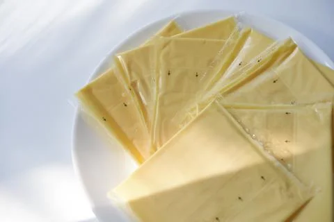 Melted cheese in flat slices. Processed cream cheese for sandwiches. Foto stock