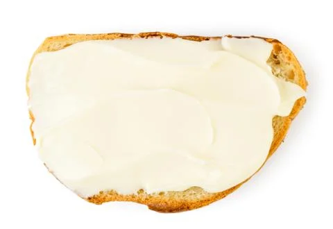 Melted cheese spread on a bread. Top view. Stock Photos