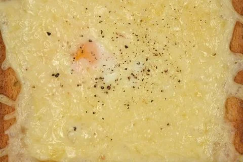 Melted cheese toast with egg macro close up Stock Photos