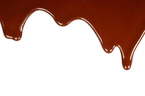 Melted chocolate dripping . Stock Photos