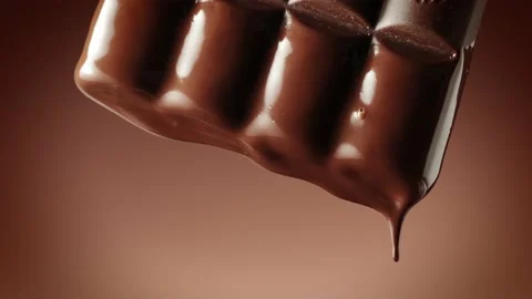 Melted chocolate flowing. Video stock 146736445