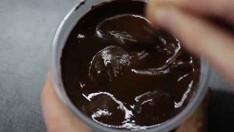 Melted chocolate in the jar Stock Footage