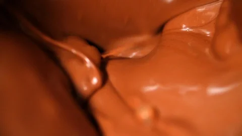 Melted Chocolate Mixing Macro in Super Slow Motion Stock Footage 128758677