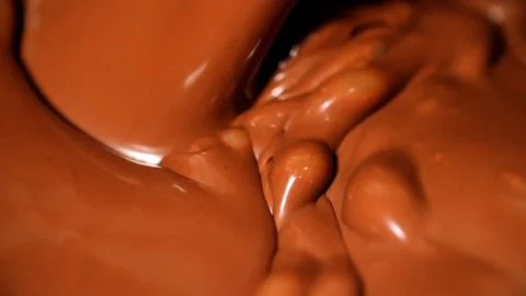 Melted Chocolate Mixing Macro in Super Slow Motion Stock Footage 128758720