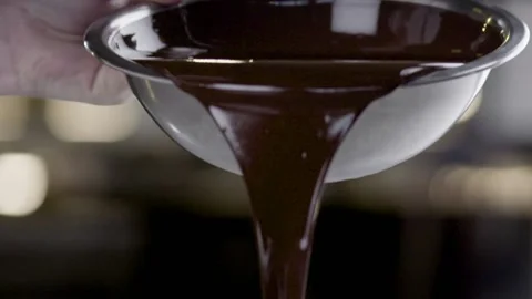 Melted Chocolate Pouring on Counter 2 Stock Footage 152470114