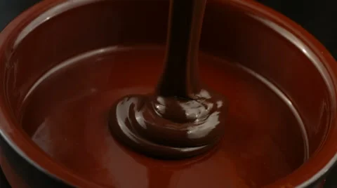 Melted Chocolate pouring in pot Stock-Footage 61671845