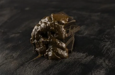 Melted dark chocolate bars Stock Photos