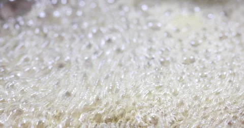 Melted dissolved sugar boiling close up Stock Footage 327754456