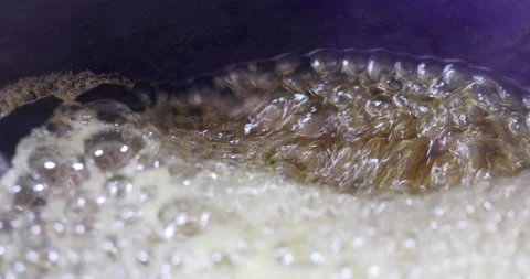 Melted dissolved sugar boiling close up Stock Footage 327754615