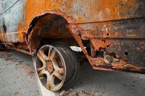 Melted Exploded Car Tire and Charred Wheel Rim Detail Stock Photos