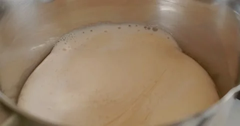 The melted milk boils in the pan. Stock Footage 148165004