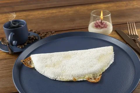 Melted mozzarella cheese tapioca, next to a cup of black coffee. Traditiona.. Stock Photos