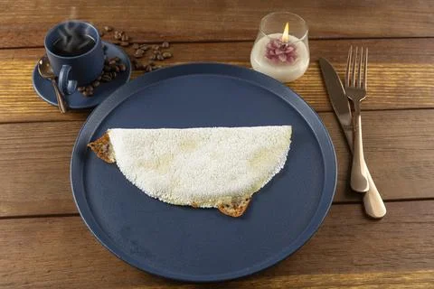 Melted mozzarella cheese tapioca, next to a cup of black coffee. Traditiona.. Stock Photos