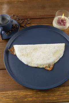 Melted mozzarella cheese tapioca, next to a cup of black coffee. Traditiona.. Stock Photos